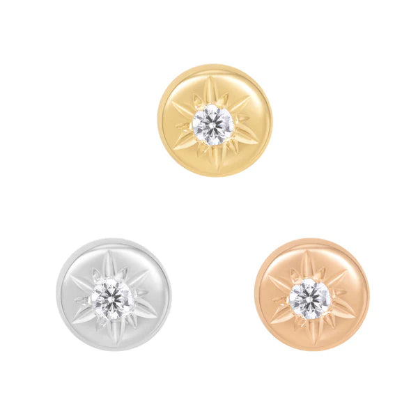14ct gold threadless piercing end with a round cubic zirconia set in a smooth disc with subtle starburst detailing, shown in yellow, white, and rose gold